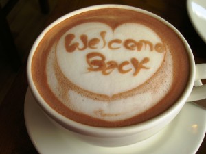 A cappuccino with the words 'Welcome Back' in the foam. 